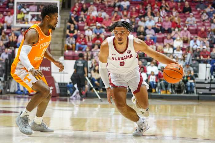 Alabama Crimson Tide guard Jaden Shackelford (5) controls the ball against Tennessee Volunteers guard Victor Bailey Jr. (12) during the second half at Coleman Coliseum.